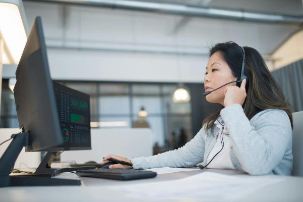 Call center agent speaking with prospects during a cold calling campaign