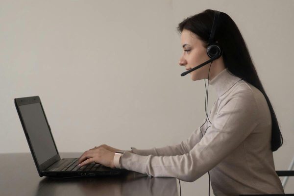Technical support outsourcing agent answering customer calls